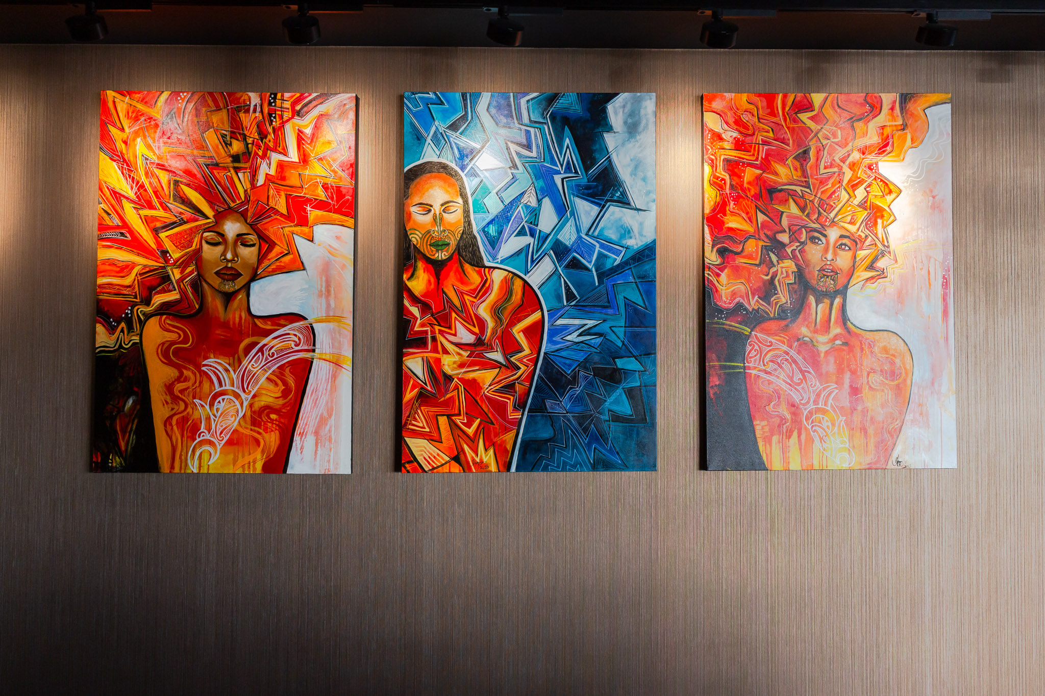 Contemporary artworks depicting figures from Māori cultural narratives, displayed within Wai Ariki Hot Springs and Spa.