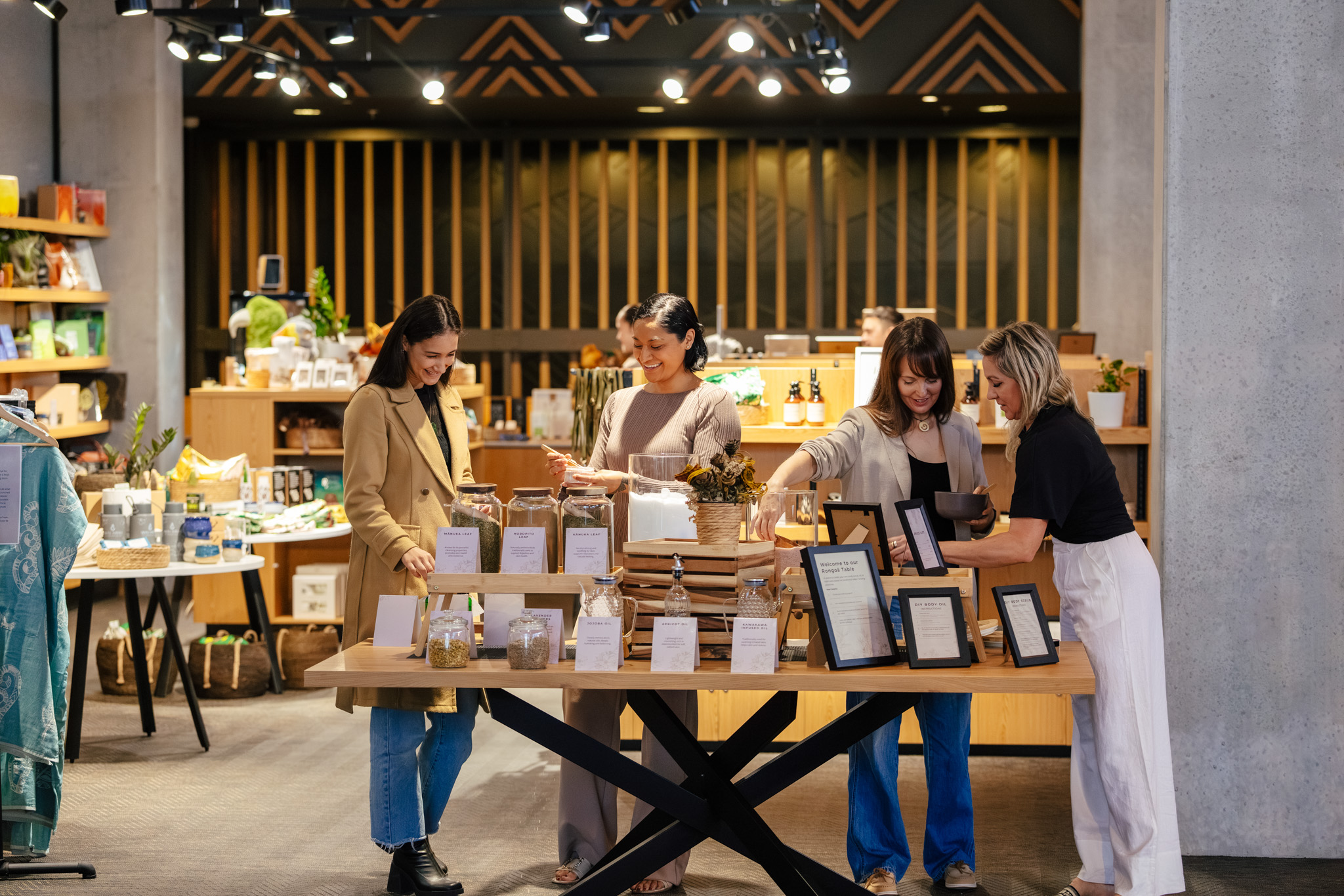 Guests browsing a curated display of locally made products inside Te Aronui Gift Store.