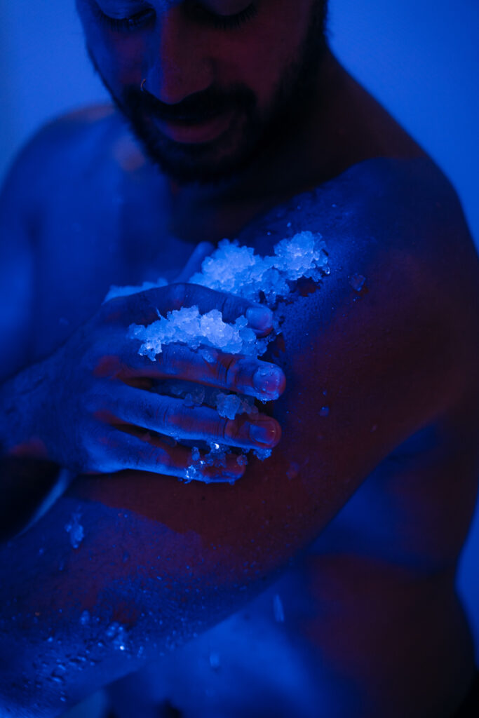 Guest experiencing the cooling element of Te Tukinga, the Tongariro Fire & Ice Caves stage of the Wai Whakaora Restorative Journey.