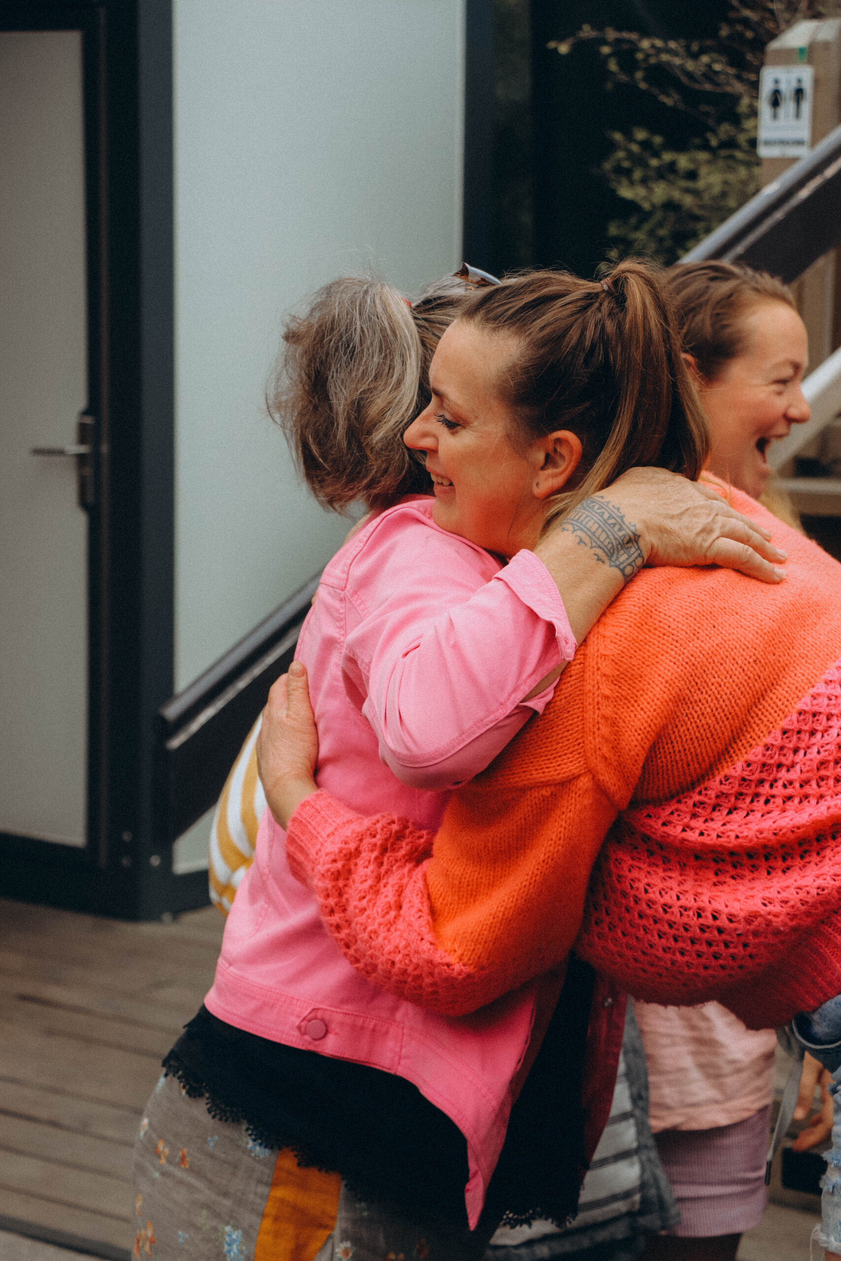 Guests embracing during a wellness gathering, capturing connection, community, and shared wellbeing experiences.